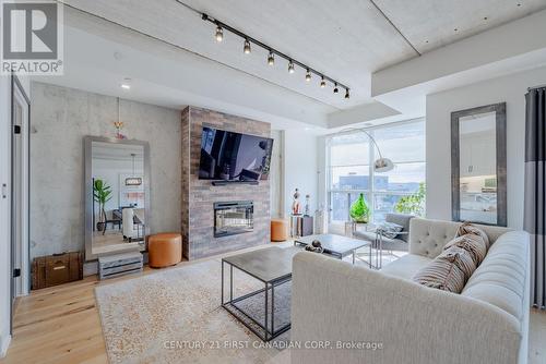 2306 - 505 Talbot Street, London, ON - Indoor Photo Showing Living Room With Fireplace