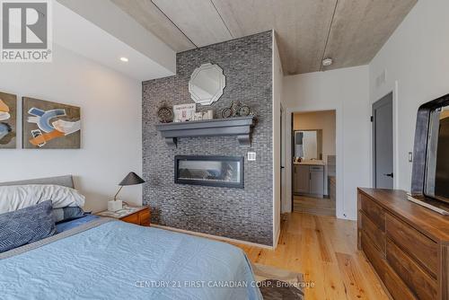 2306 - 505 Talbot Street, London, ON - Indoor Photo Showing Bedroom With Fireplace