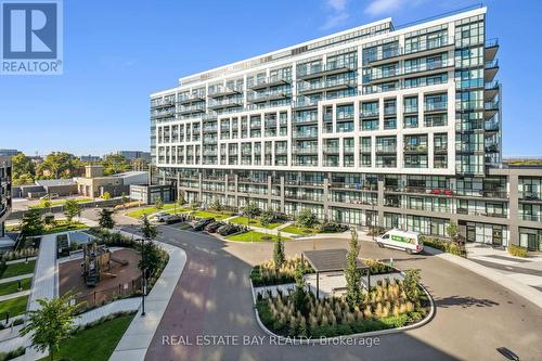 413 - 60 George Butchart Drive, Toronto, ON - Outdoor With Balcony With Facade