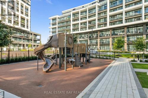 413 - 60 George Butchart Drive, Toronto, ON - Outdoor With Balcony With Facade