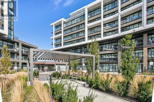 413 - 60 George Butchart Drive, Toronto, ON - Outdoor With Balcony With Facade