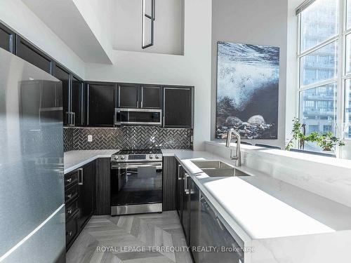 210-300 Manitoba St, Toronto, ON - Indoor Photo Showing Kitchen With Double Sink With Upgraded Kitchen