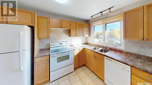 221 Lorne Street, Regina, SK - Indoor Photo Showing Kitchen With Double Sink