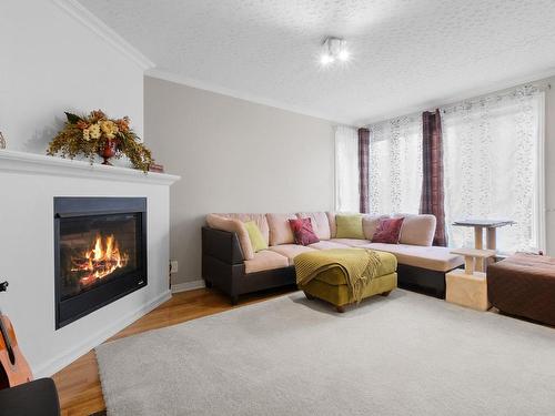 Salon - 553 Rue Alban-Lavigne, Gatineau (Gatineau), QC - Indoor Photo Showing Living Room With Fireplace