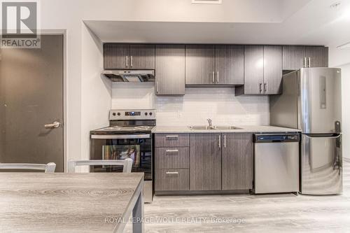 B404 - 275 Larch Street, Waterloo, ON - Indoor Photo Showing Kitchen With Double Sink