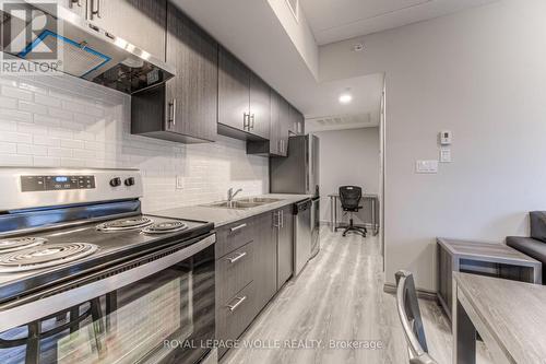 B404 - 275 Larch Street, Waterloo, ON - Indoor Photo Showing Kitchen With Double Sink With Upgraded Kitchen