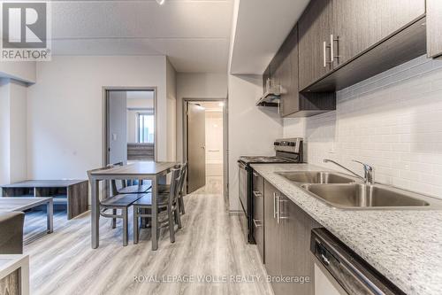 B404 - 275 Larch Street, Waterloo, ON - Indoor Photo Showing Kitchen With Double Sink