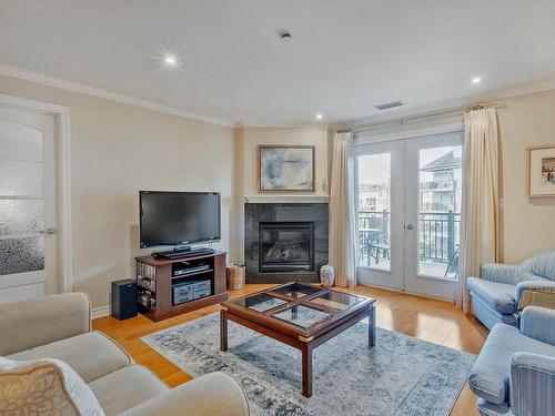 Salon - 402-361 Rue Jacques-Lavigne, Sainte-Thérèse, QC - Indoor Photo Showing Living Room With Fireplace