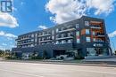 323 - 430 Essa Road, Barrie, ON  - Outdoor With Balcony With Facade 