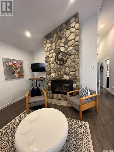 118 Eugene Drive, Sandy Beach, SK - Indoor Photo Showing Other Room With Fireplace