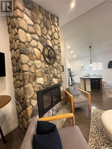 118 Eugene Drive, Sandy Beach, SK - Indoor Photo Showing Living Room With Fireplace