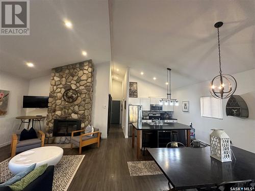 118 Eugene Drive, Sandy Beach, SK - Indoor Photo Showing Dining Room With Fireplace