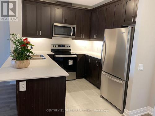 410 - 830 Megson Terrace, Milton, ON - Indoor Photo Showing Kitchen With Double Sink With Upgraded Kitchen