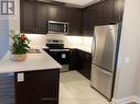 410 - 830 Megson Terrace, Milton, ON  - Indoor Photo Showing Kitchen With Double Sink With Upgraded Kitchen 