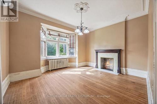 15 Laws Street, Toronto, ON - Indoor Photo Showing Living Room With Fireplace