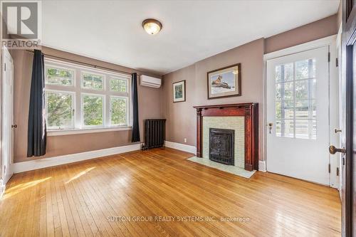 15 Laws Street, Toronto, ON - Indoor Photo Showing Living Room With Fireplace