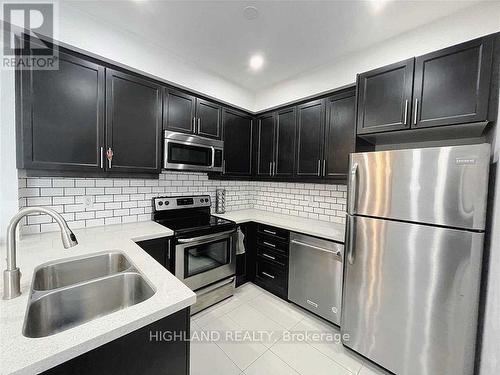 303 - 2333 Sawgrass Drive, Oakville, ON - Indoor Photo Showing Kitchen With Stainless Steel Kitchen With Double Sink With Upgraded Kitchen