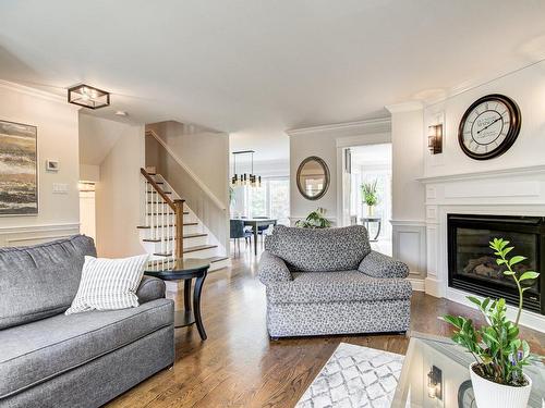 Salon - 3 Av. Des Sorbiers, Bois-Des-Filion, QC - Indoor Photo Showing Living Room With Fireplace