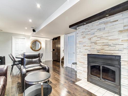 Salle familiale - 3 Av. Des Sorbiers, Bois-Des-Filion, QC - Indoor Photo Showing Living Room With Fireplace