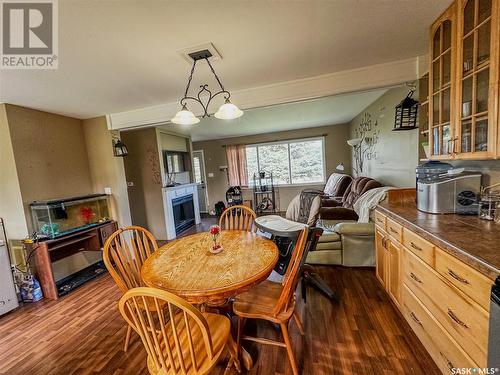 217 Cottonwood Crescent, Churchbridge, SK - Indoor Photo Showing Dining Room With Fireplace