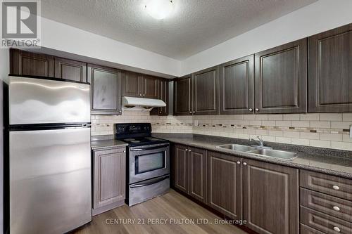 1004 - 5580 Sheppard Avenue E, Toronto, ON - Indoor Photo Showing Kitchen With Double Sink