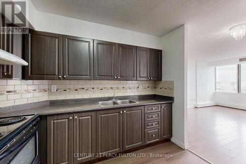 1004 - 5580 Sheppard Avenue E, Toronto, ON - Indoor Photo Showing Kitchen With Double Sink