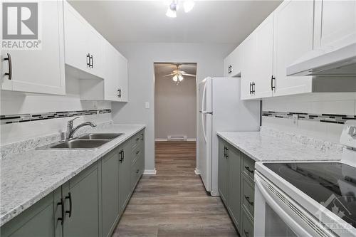 1100 Millwood Avenue Unit#309, Brockville, ON - Indoor Photo Showing Kitchen With Double Sink