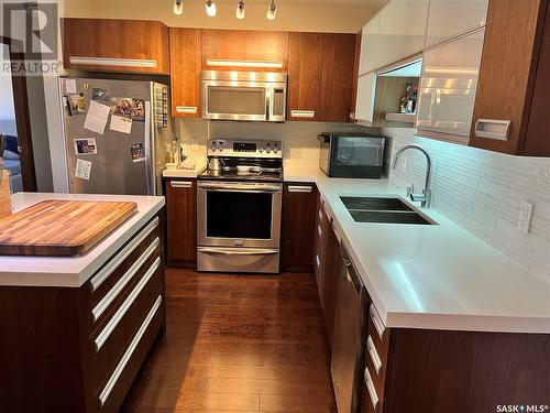 203 130 Phelps Way, Saskatoon, SK - Indoor Photo Showing Kitchen With Double Sink