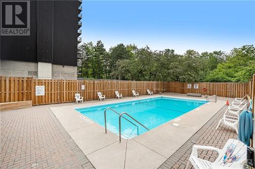 555 Brittany Drive Unit#313, Ottawa, ON - Outdoor With In Ground Pool