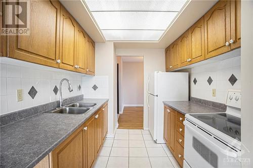 555 Brittany Drive Unit#313, Ottawa, ON - Indoor Photo Showing Kitchen With Double Sink