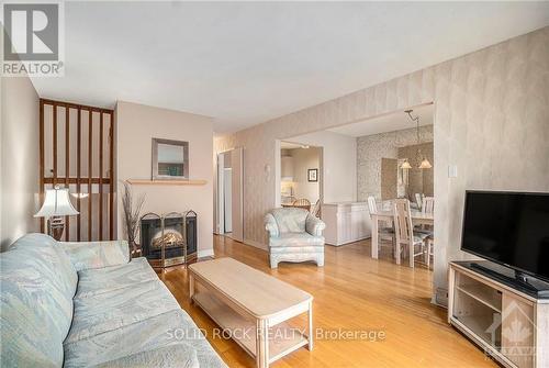 150 - 825 Cahill Drive W, Ottawa, ON - Indoor Photo Showing Living Room With Fireplace