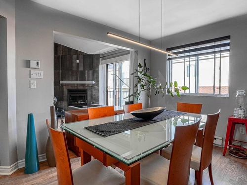 Salle Ã  manger - 306-7055 Rue Bombardier, Montréal (Anjou), QC - Indoor Photo Showing Dining Room With Fireplace