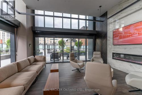 907 - 8 Hughson Street N, Hamilton, ON - Indoor Photo Showing Living Room With Fireplace