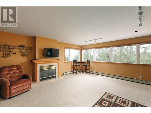 1642 West Kelowna Road, West Kelowna, BC - Indoor Photo Showing Living Room With Fireplace