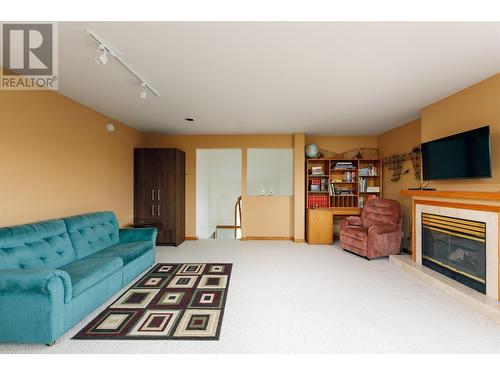 1642 West Kelowna Road, West Kelowna, BC - Indoor Photo Showing Living Room With Fireplace