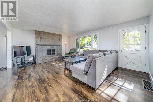 231 Detroit Line, Wheatley, ON - Indoor Photo Showing Living Room With Fireplace