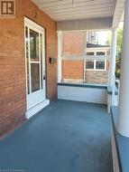 Freshly painted porch leading to the unit entrance - 