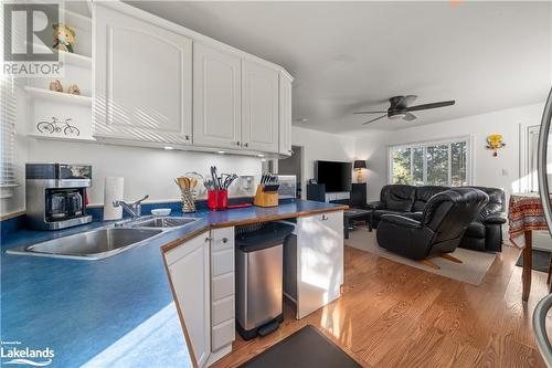 1050 Privet Drive, Minden Hills, ON - Indoor Photo Showing Kitchen With Fireplace With Double Sink