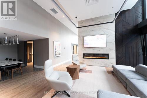 901 - 8 Hughson Street N, Hamilton, ON - Indoor Photo Showing Living Room With Fireplace