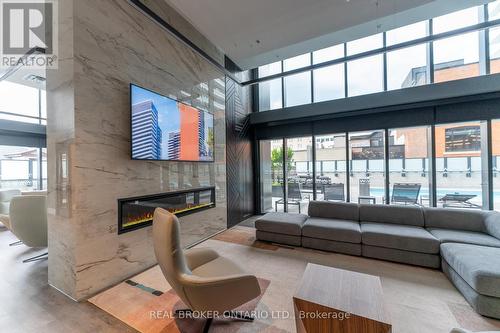 901 - 8 Hughson Street N, Hamilton, ON - Indoor Photo Showing Living Room With Fireplace