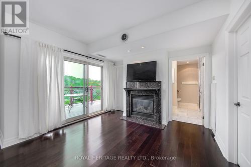 605 - 130 Steamship Bay Road, Gravenhurst, ON - Indoor Photo Showing Living Room With Fireplace