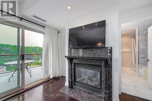 605 - 130 Steamship Bay Road, Gravenhurst, ON - Indoor Photo Showing Living Room With Fireplace