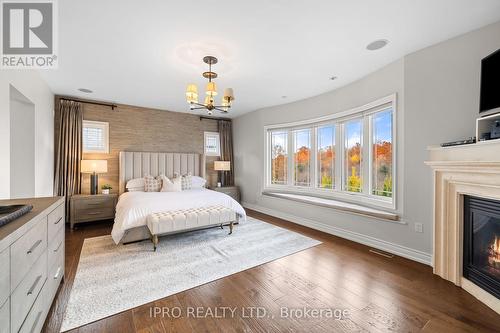 24 Bluff Trail, King, ON - Indoor Photo Showing Bedroom With Fireplace