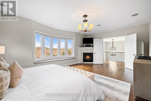 24 Bluff Trail, King, ON - Indoor Photo Showing Bedroom With Fireplace