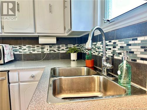 33 Aéroport Street, Edmundston, NB - Indoor Photo Showing Kitchen With Double Sink