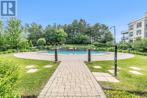 211 - 180 John West Way, Aurora, ON - Outdoor With In Ground Pool With Backyard