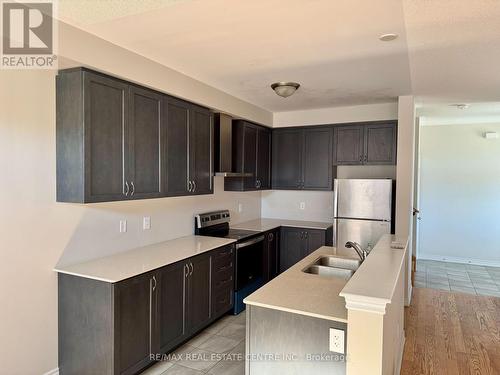 17 Bushwood Trail, Brampton, ON - Indoor Photo Showing Kitchen With Double Sink