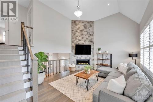 Mid Level Family Room with Gas Fireplace - 976 Shimmerton Circle, Kanata, ON - Indoor Photo Showing Living Room With Fireplace