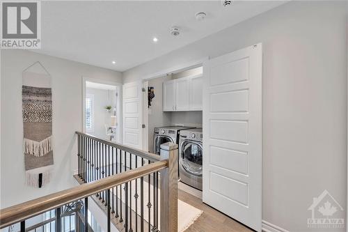 Upstairs Laundry Closet - 976 Shimmerton Circle, Kanata, ON - Indoor Photo Showing Laundry Room