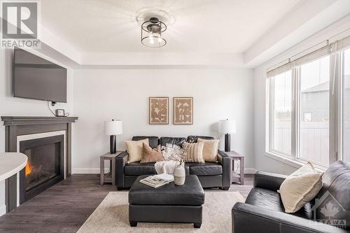 627 Monardia Way, Ottawa, ON - Indoor Photo Showing Living Room With Fireplace